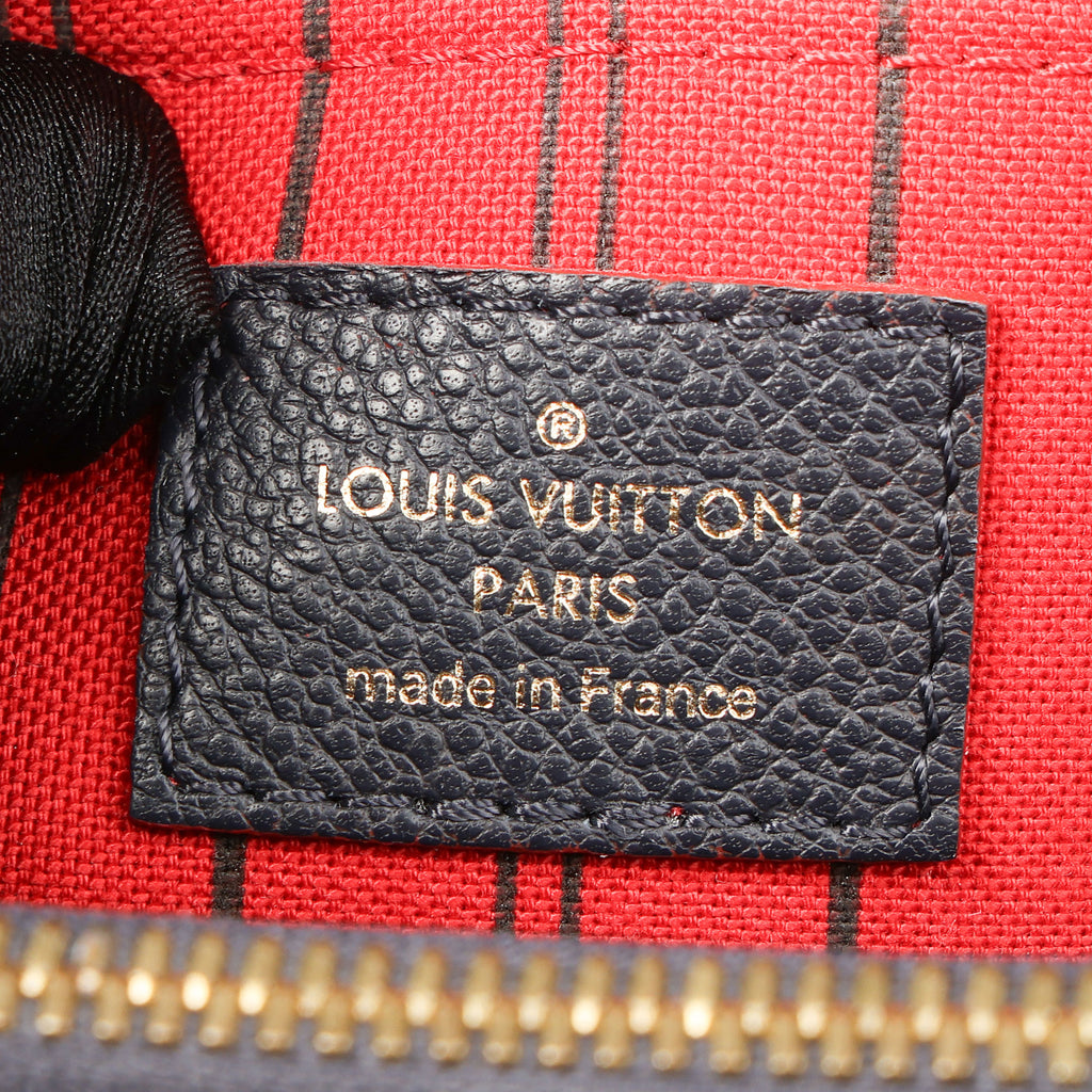 Preowned LOUIS VUITTON Montaigne MM Monogram Empreinte Leather Navy Blue | Luxe Again Maison