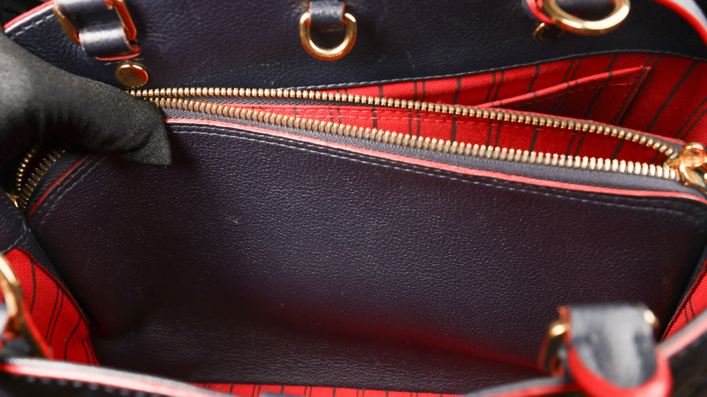 Preowned LOUIS VUITTON Montaigne MM Monogram Empreinte Leather Navy Blue | Luxe Again Maison