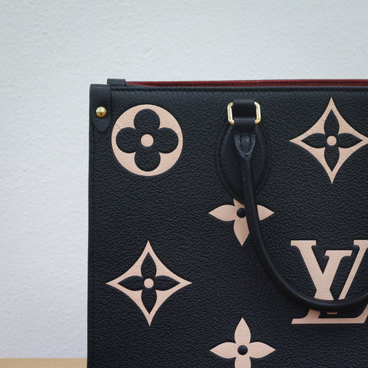 Preloved authentic LOUIS VUITTON On the Go MM M45495 Bicolor Black Monogram Empreinte Leather Tote Bag | Luxe Again Maison