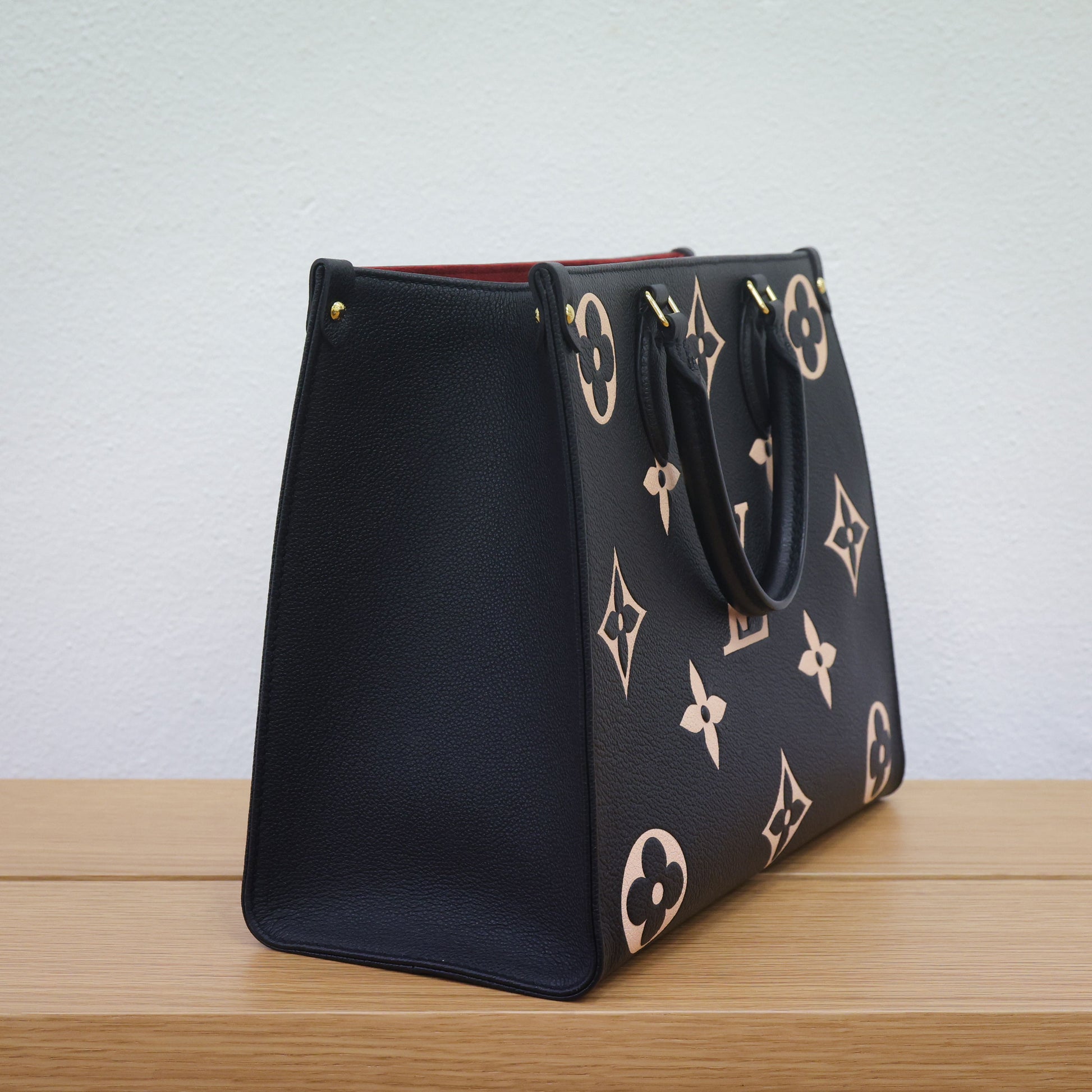 Preloved authentic LOUIS VUITTON On the Go MM M45495 Bicolor Black Monogram Empreinte Leather Tote Bag | Luxe Again Maison