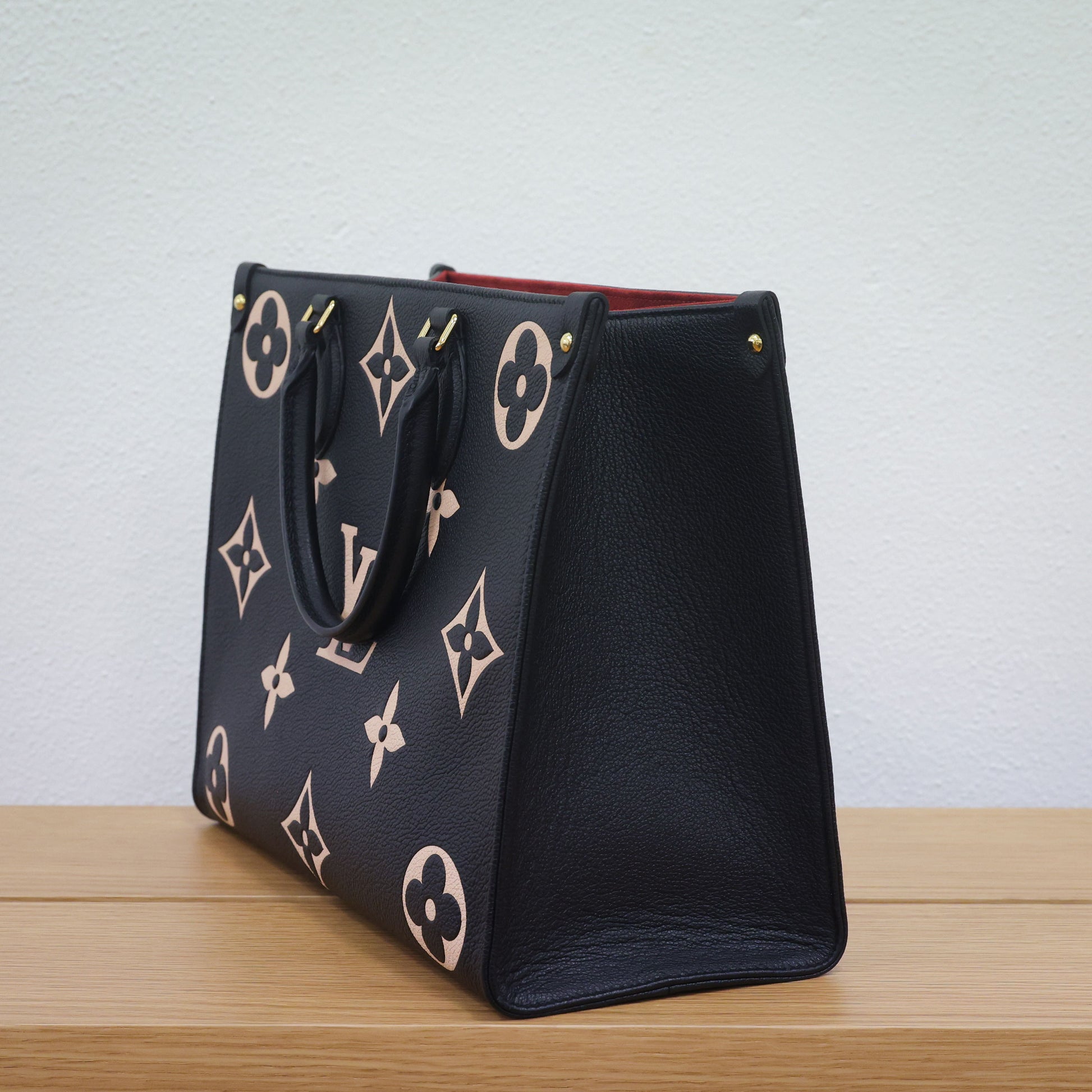 Preloved authentic LOUIS VUITTON On the Go MM M45495 Bicolor Black Monogram Empreinte Leather Tote Bag | Luxe Again Maison