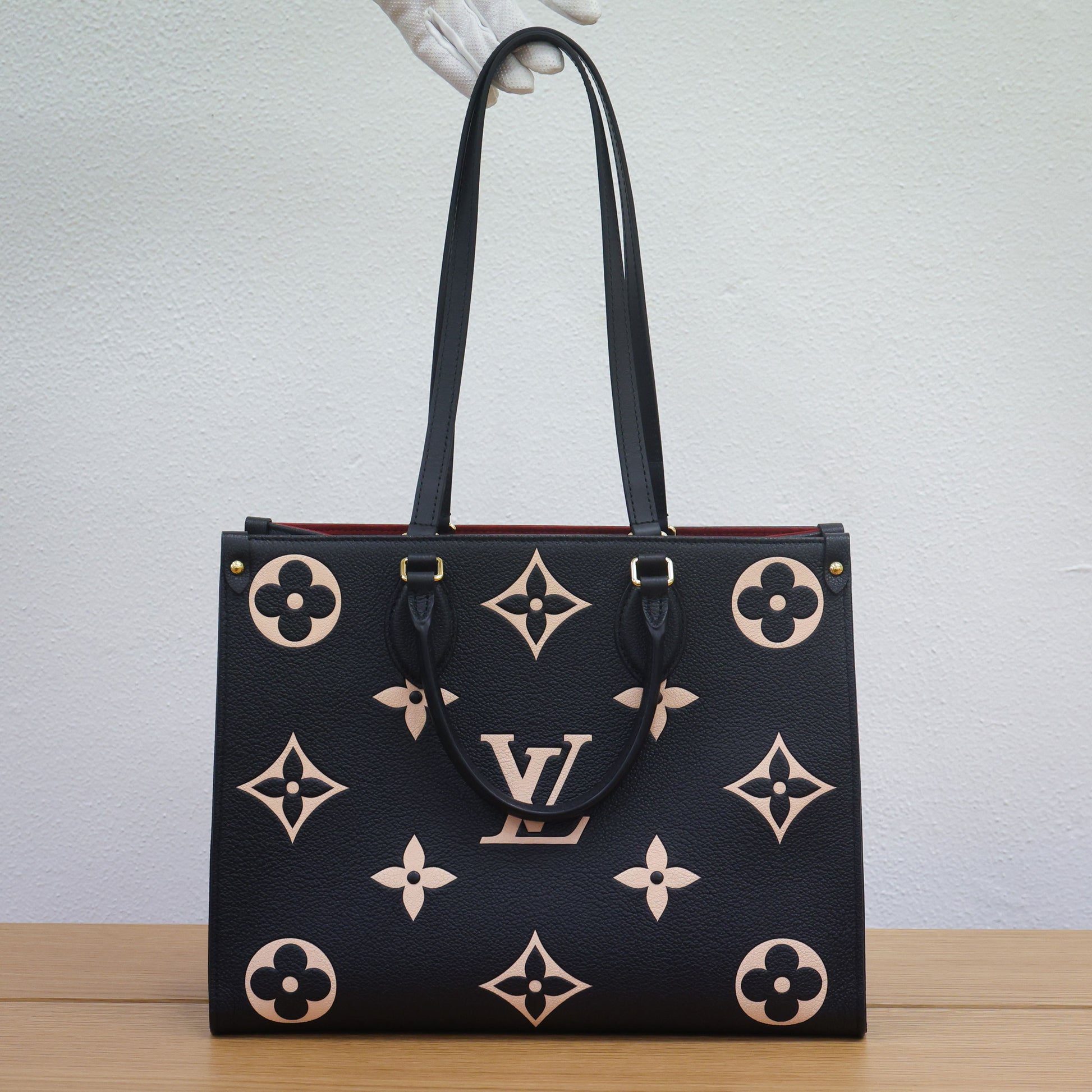 Preloved authentic LOUIS VUITTON On the Go MM M45495 Bicolor Black Monogram Empreinte Leather Tote Bag | Luxe Again Maison