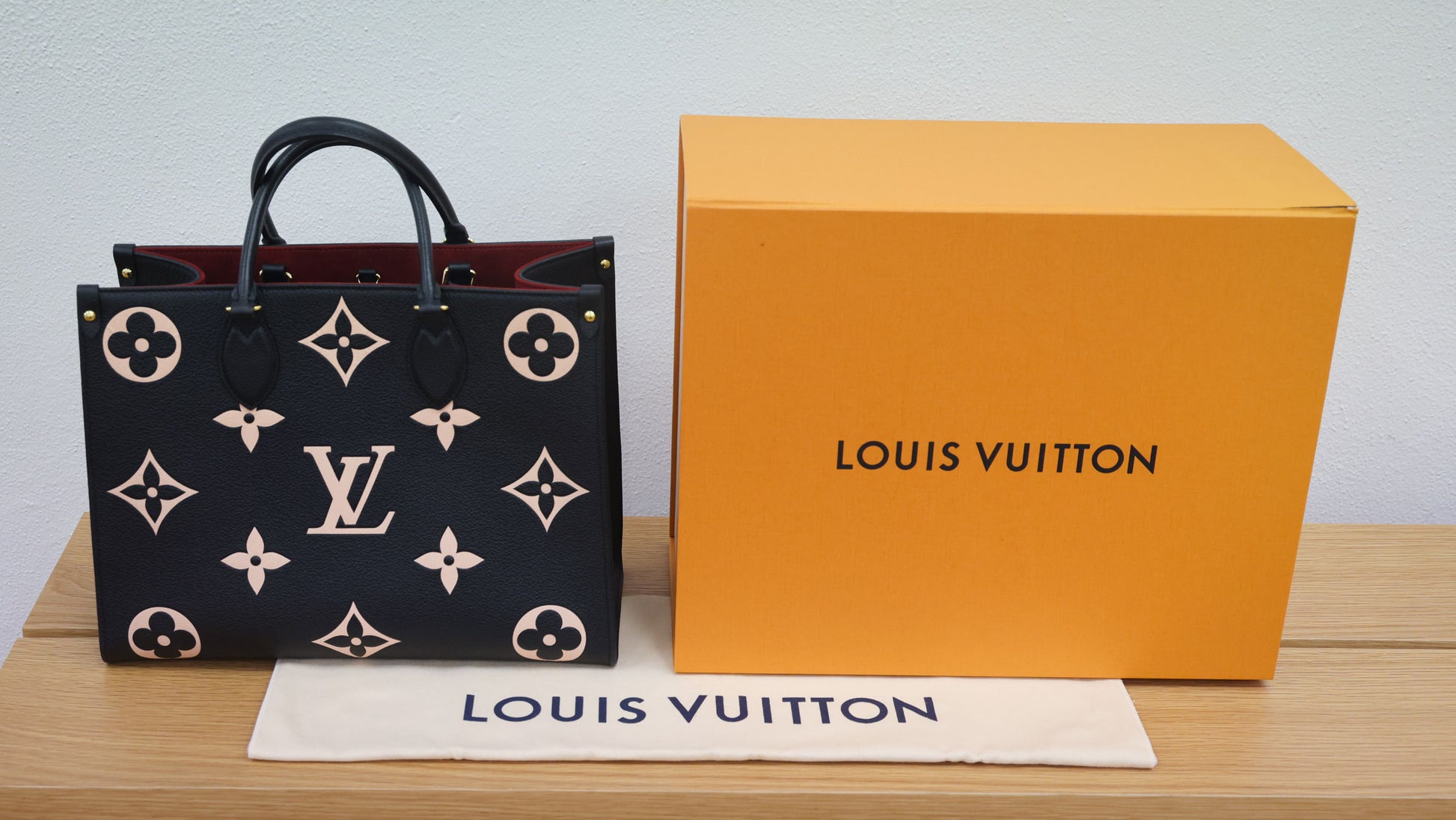 Preloved authentic LOUIS VUITTON On the Go MM M45495 Bicolor Black Monogram Empreinte Leather Tote Bag | Luxe Again Maison
