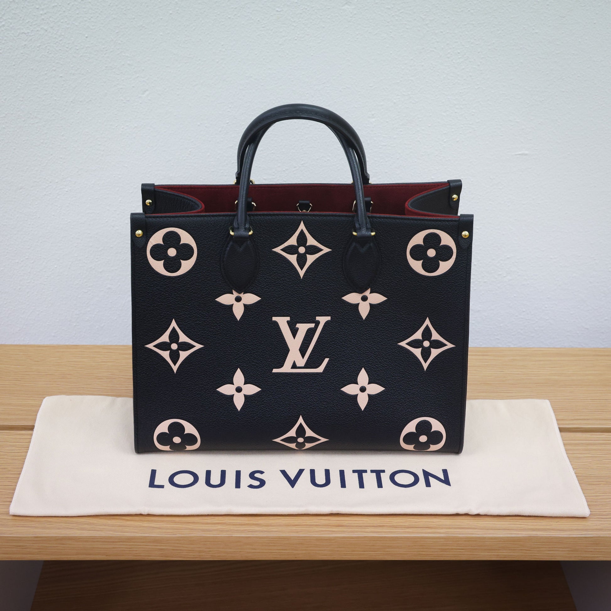 Preloved authentic LOUIS VUITTON On the Go MM M45495 Bicolor Black Monogram Empreinte Leather Tote Bag | Luxe Again Maison
