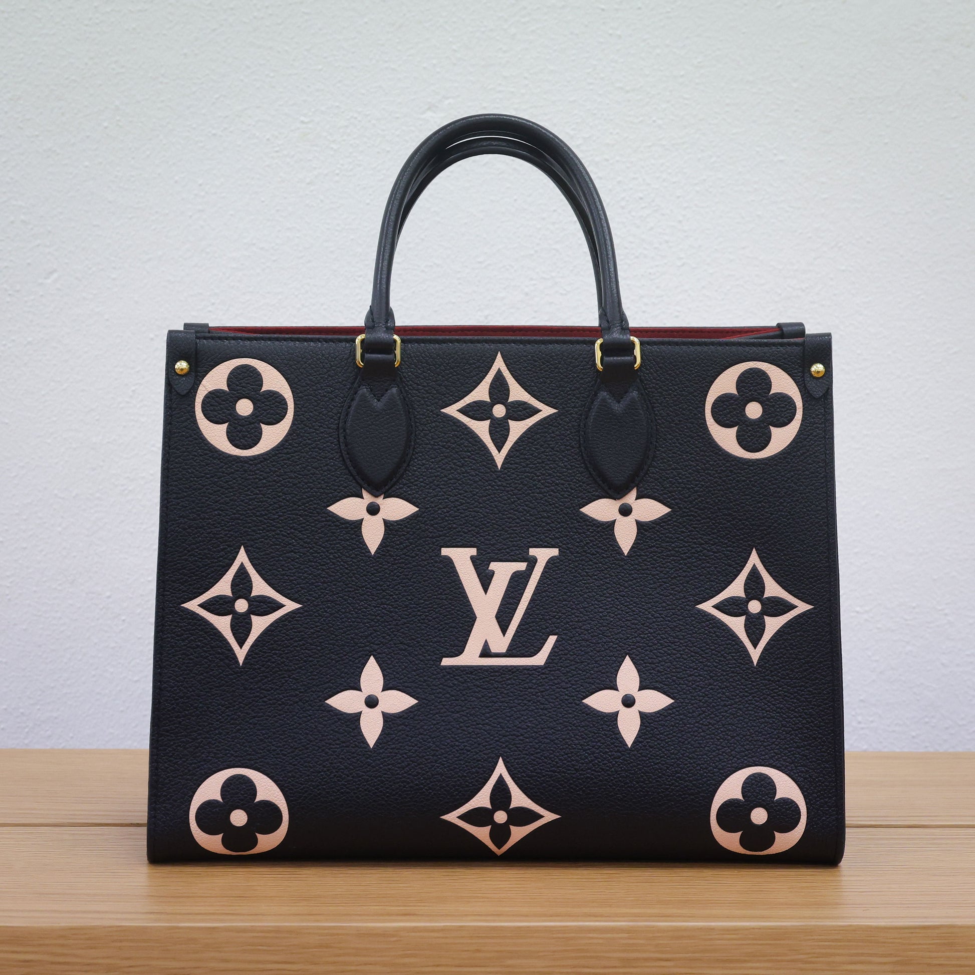 Preloved authentic LOUIS VUITTON On the Go MM M45495 Bicolor Black Monogram Empreinte Leather Tote Bag | Luxe Again Maison