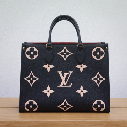Preloved authentic LOUIS VUITTON On the Go MM M45495 Bicolor Black Monogram Empreinte Leather Tote Bag | Luxe Again Maison