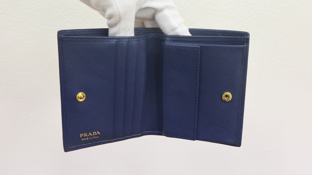 Pre-owned authentic PRADA 2018 Saffiano Leather Navy Bi-fold Clasp Slim Wallet 1M0204 | Box + G Card | Luxe Again Maison