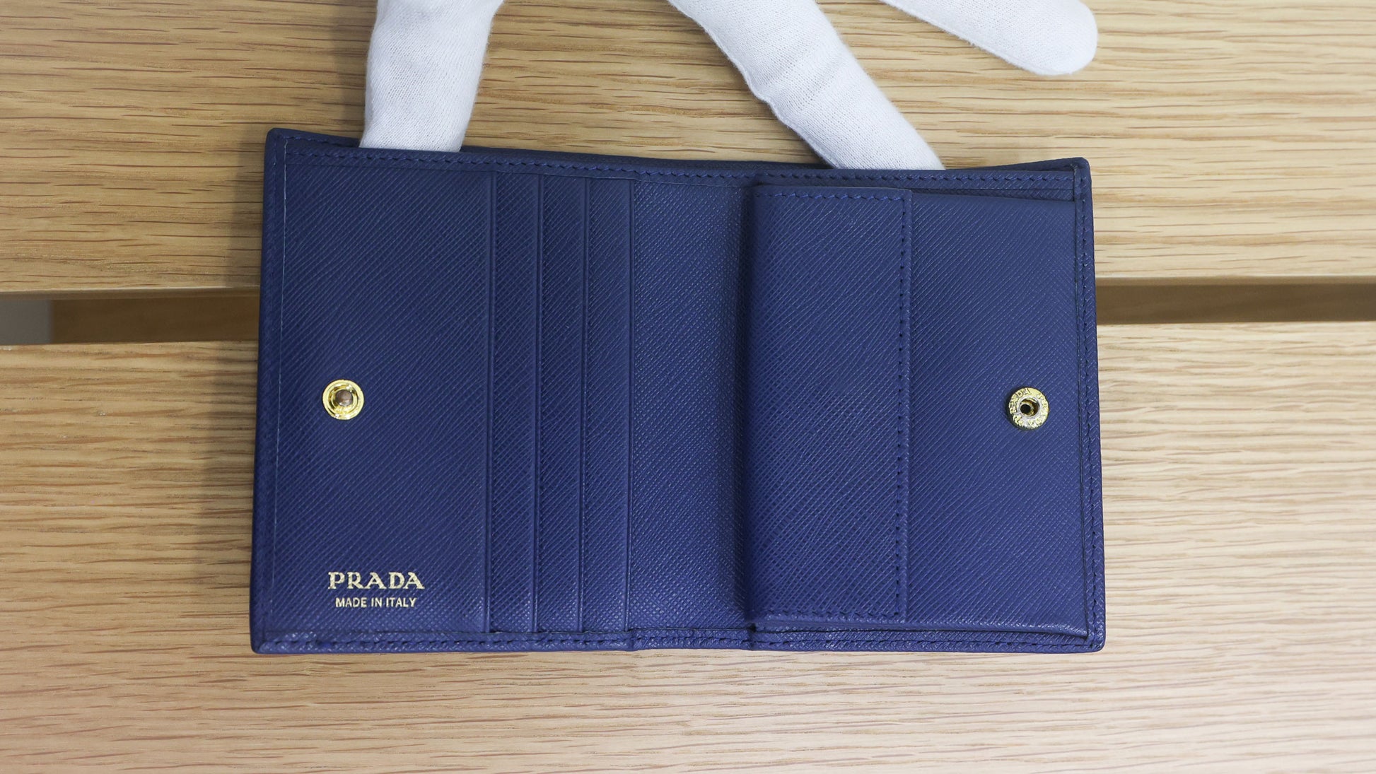 Pre-owned authentic PRADA 2018 Saffiano Leather Navy Bi-fold Clasp Slim Wallet 1M0204 | Box + G Card | Luxe Again Maison