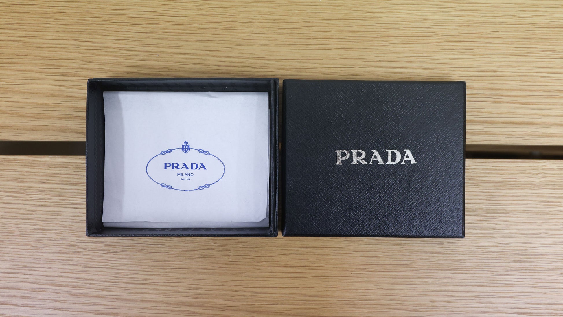 Pre-owned authentic PRADA 2018 Saffiano Leather Navy Bi-fold Clasp Slim Wallet 1M0204 | Box + G Card | Luxe Again Maison