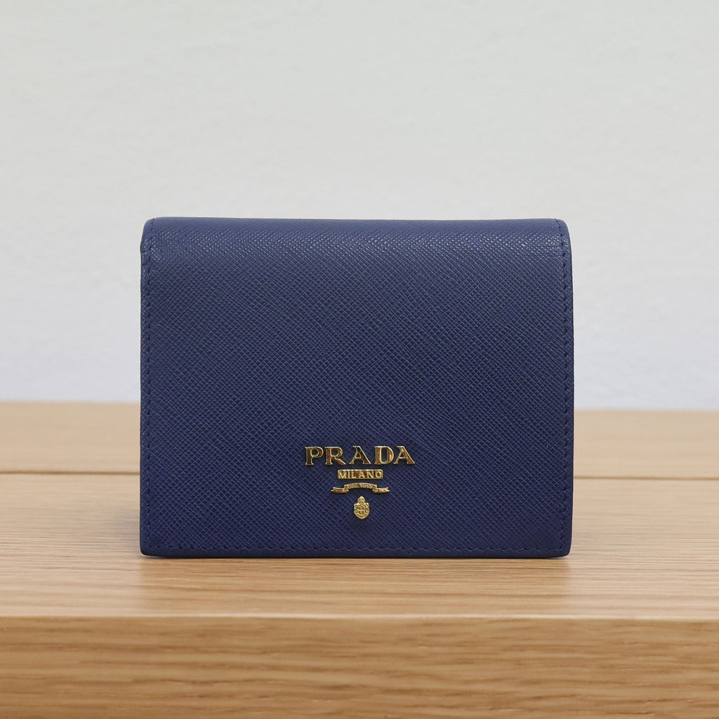 Pre-owned authentic PRADA 2018 Saffiano Leather Navy Bi-fold Clasp Slim Wallet 1M0204 | Box + G Card | Luxe Again Maison